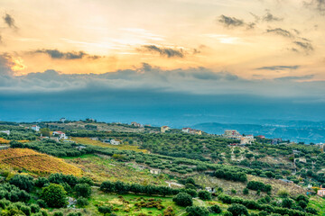 Fototapeta na wymiar Beautiful view of landscape with olive trees and mountains on Crete island during sunset.