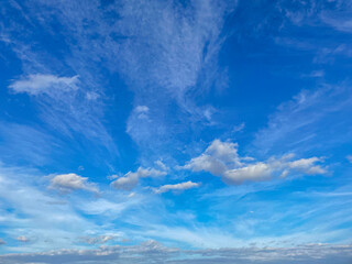 Background with blue sky and white clouds.