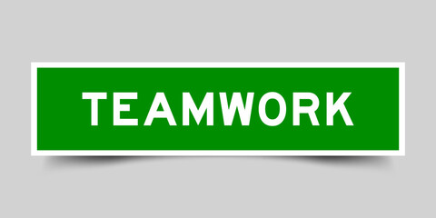 Square sticker label with word teamwork in green color on gray background