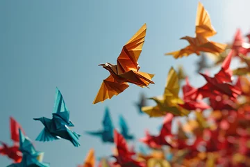 Fototapeten Witness the grace of colorful paper origami birds soaring against a clear blue sky in a captivating and artistic composition. Ai generated © dragomirescu