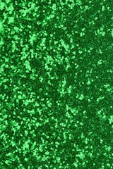 background of glitterd material of color GREEN ideal as backdrop