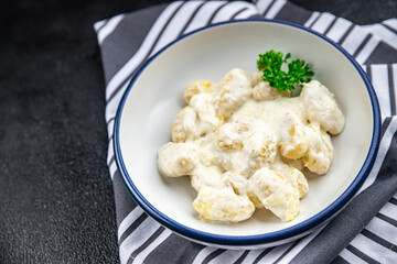 gnocchi cheese sauce potato dough fresh healthy eating cooking appetizer meal food snack on the table copy space food background rustic top view