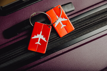 Close up of luggage tag label on suitcase or bag with travel insurance. 