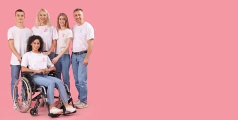Young woman in wheelchair and group of people with cancer awareness ribbons on pink background. Banner for design