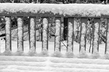 Snow covered slates on a bench