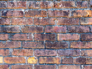 Fototapeta premium Old, weathered brick wall