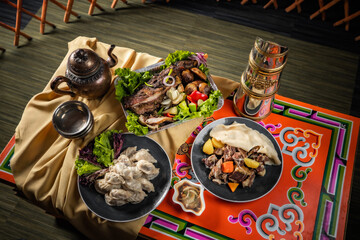 mongolian tsagaan sar food, mongolian lunar year meat food, national food on traditional table - obrazy, fototapety, plakaty