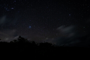 View of stars and clouds at Savinia beach located on the south coast of Mauritius island