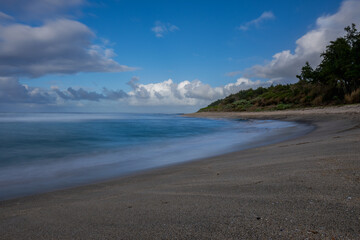 Fototapeta na wymiar Long exposure view of Savinia beach during a morning on the south coast of Mauritius island