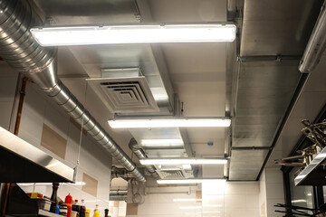 Restaurant kitchen ceiling. Ventilation system in cafe. Ensuring air circulation for food...