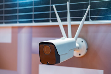 WIFI camera hangs on wall. CCTV with antennas for signal transmission. Wireless surveillance...