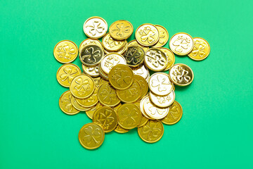 Golden coins on green background. St. Patrick's Day celebration