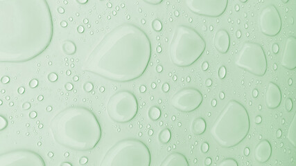 Illustration of a light green background with clear drop patterns