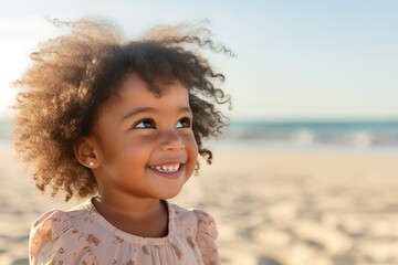 Portrait of Smiling African child girl in swimwear and swim ring playing on tropical beach in summer sunny day. Happy little girl enjoy and fun outdoor activity lifestyle on travel vacation at the sea