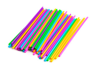 Heap of colorful plastic straws on white background