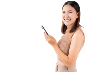 Happy excited young asian girl using mobile phone isolated on white background copy space Young girl using smartphone for shopping online chat and texting message She get surprised looking at camera