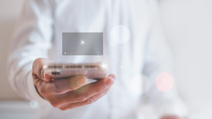 man using smartphone for streaming online, watching video on internet, live concert, show or tutorial