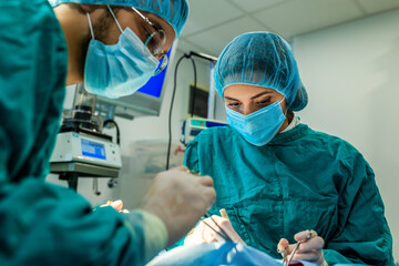 Concentrated Surgical team operating a patient in an operation theater
