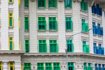 Brightly colored shutters and windows on the landmark Old Hill Street Police Station building in Singapore