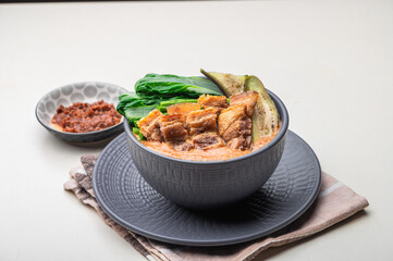 Crispy Pork Kare Kare (Peanut Sauce) with Vegetables and Shrimp Paste on the side 


