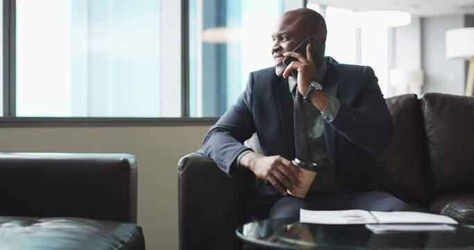 Smartphone call, talking and professional black man consulting with user, financial advisor or investment contact. Morning green tea, networking and African insurance agent on cellphone negotiation
