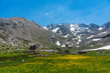 Fototapeta na wymiar Bolkar mountains from various angles green colored nature flowing water lakes cloudy sky and steep sharp rock forms