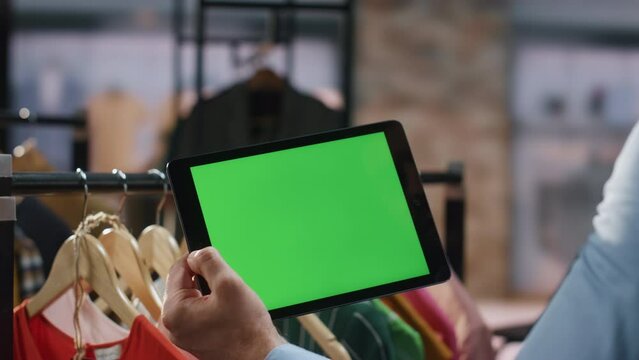 Man hands typing mockup tab computer at shop closeup. Store worker using tablet