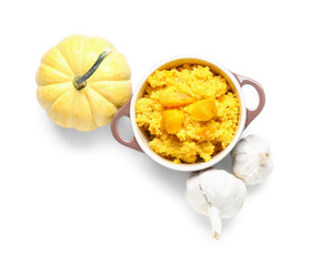 Pot of tasty millet porridge with pumpkin and fresh vegetables on white background