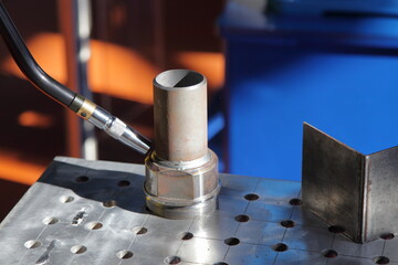 Automatic tubes welding MIG MAG equipment closeup - obrazy, fototapety, plakaty