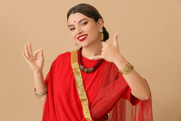 Beautiful young Indian woman showing 