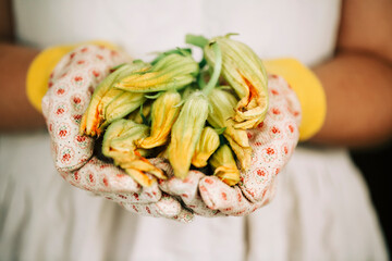 person holding a bunch of vegetables