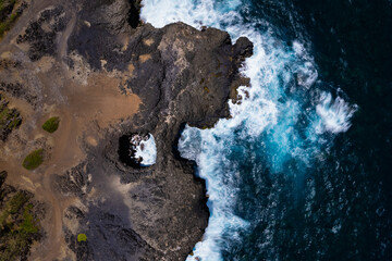 Aerial top view of 'Pont Naturel' which is a natural bridge formed by lava many years ago on the...