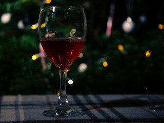 Glass of red wine on Christmas background