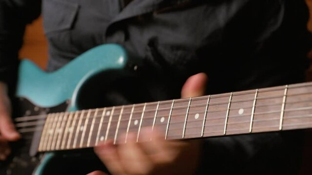 Man playing electric guitar. 4k video footage UHD 3840x2160
