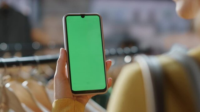 Customer lady scrolling chromakey smartphone mall closeup. Shopaholic browsing - Powered by Adobe