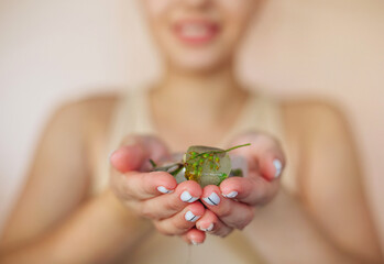 woman holding leaf