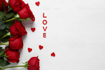 Red roses, hearts and word LOVE on white background