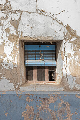 window with old shutter and cracked walls, vintage