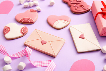 Sweet cookies with marshmallows and gift on lilac background. Valentine's Day celebration