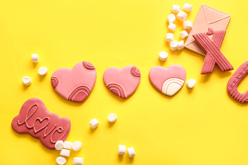Sweet cookies with marshmallows on yellow background. Valentine's Day celebration