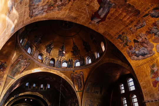 Venice, Italy, 12 February 2023: Interior of Patriarchal Cathedral Basilica of Saint Mark, Italian Byzantine Architecture, mosaic decoration art, arcades and arches, dome rests on four barrel vaults