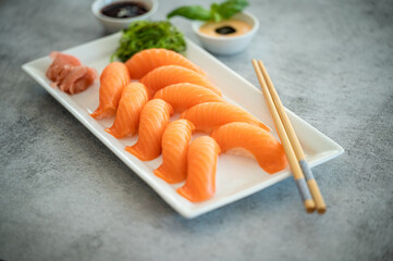 Fresh Sushi Roll with salmon.Japanese food. Copyspace black background.