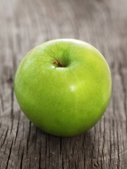 green apple on wooden table