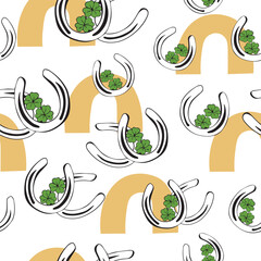 seamless pattern metal horseshoes and clover leaf for good luck and boho rainbow. Irish lucky green clover in the shape of horseshoe. happy clover and horseshoe on St. Patrick's Day.