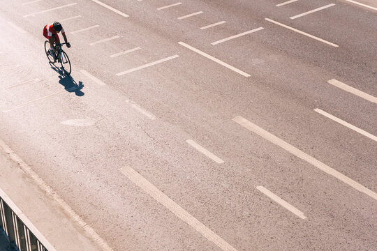 a professional cyclist riding on the road. training of a cyclist in a megalopolis along a general traffic route. a man on a professional bicycle in Istanbul