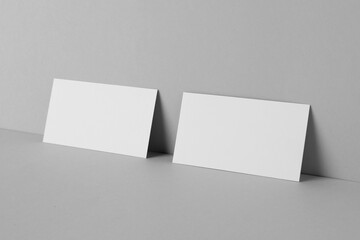 Blank business cards on light gray background. Mockup for design