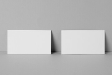 Blank business cards on light gray background. Mockup for design