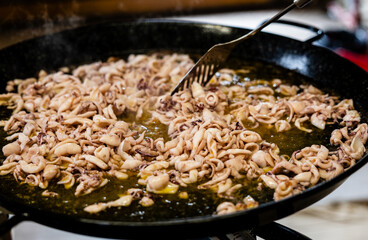 Detail of cooking squid in a big pot