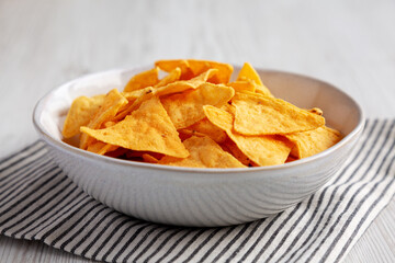 Homemade Cheese Tortilla Chips in a Bowl, side view.