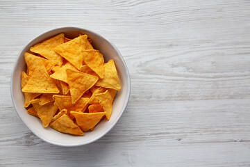 Mexican Cheese Tortilla Chips in a Bowl, top view. Copy space.